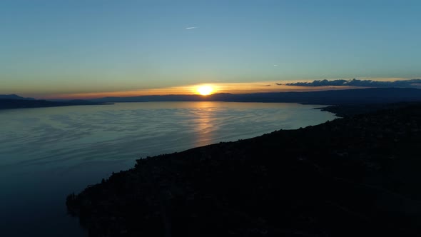 Aerial fast climb with sunset over Lake Léman, Vaud - Switzerland