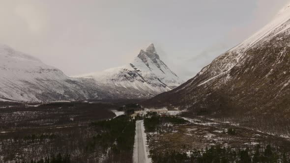 Signaldalen Valley During Winter In Northern Norway, Otertinden Mountain On The Background - aerial