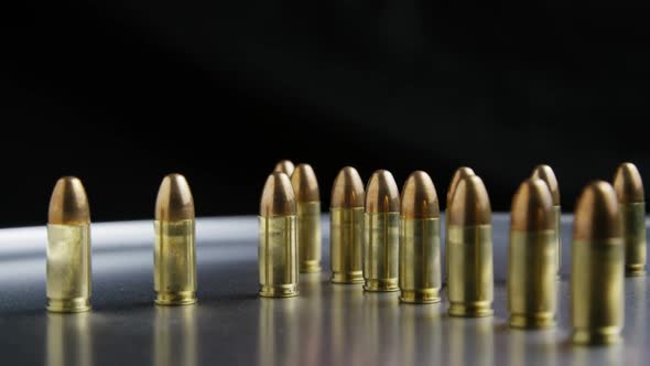 Cinematic rotating shot of bullets on a metallic surface - BULLETS 034