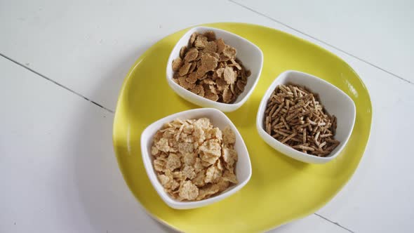 Wheat flakes and cereal bran sticks in bowl 4k
