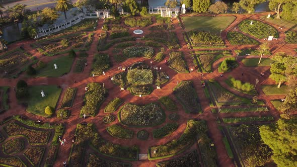 circular flight in birds eye view of people walking in the rosedal park of palermo in buenos aires a