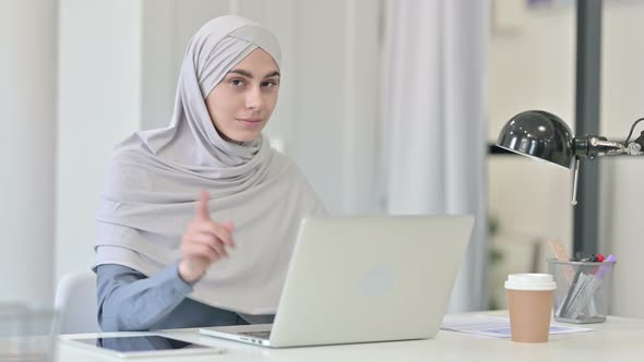Young Arab Woman with Laptop Saying No By Head Shake