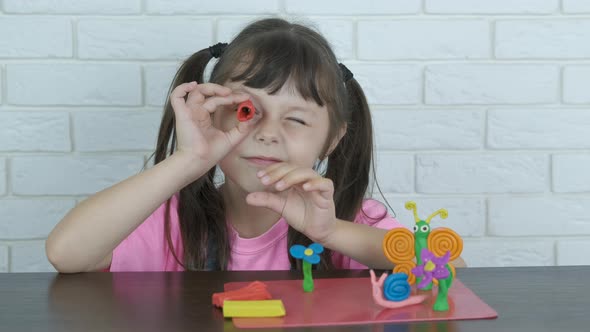 Kid with plasticine. alt