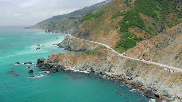 Aerial View of Winding Coastal Highway and Freeway Road Rocky Beach Seascape