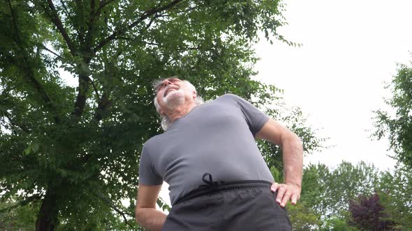 Senior man circling pelvis during training