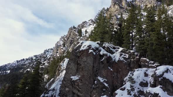 Rising up along cliffs in winter viewing snow covered mountain