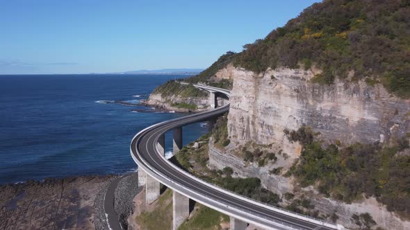 close up aerial clip of sea cliff bridge- flying forward to the south