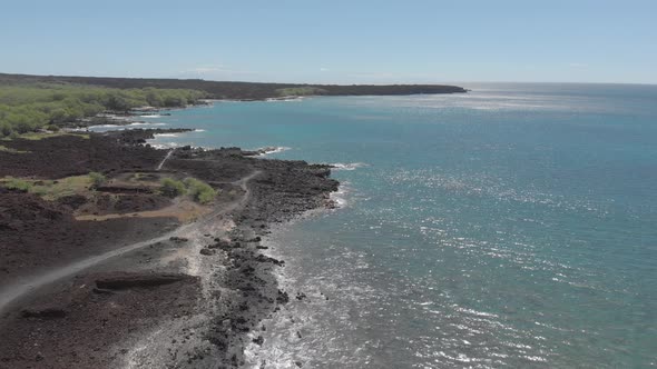 Beautiful 4k drone shot of black sand volcanic beach. Southwest of Hana, Maui.