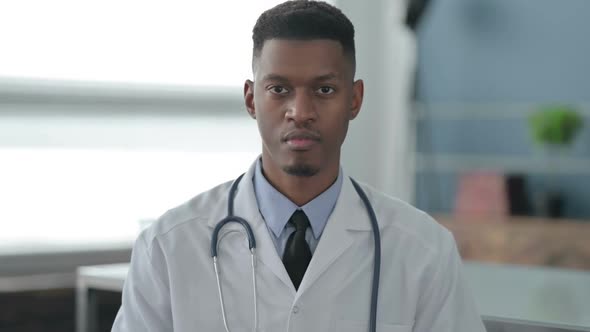 Portrait of Serious African Doctor Looking at the Camera