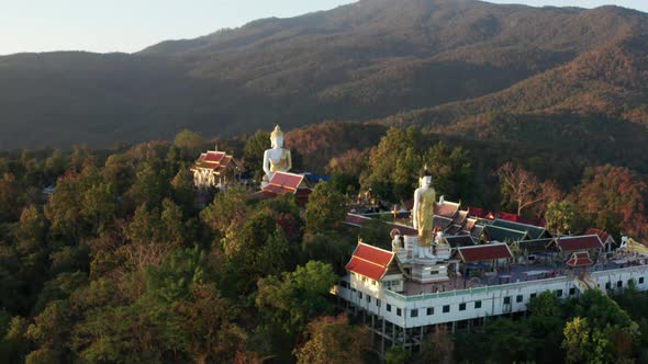 Aerial View of Wat Phrathat Doi Kham Buddha Pagoda and Golden Chedi in Chiang Mai Thailand alt