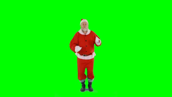 Santa claus dancing against green background