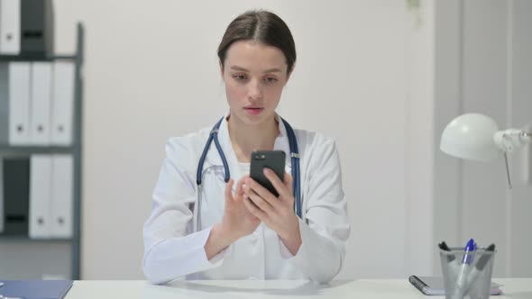 Female Doctor Using Smartphone 