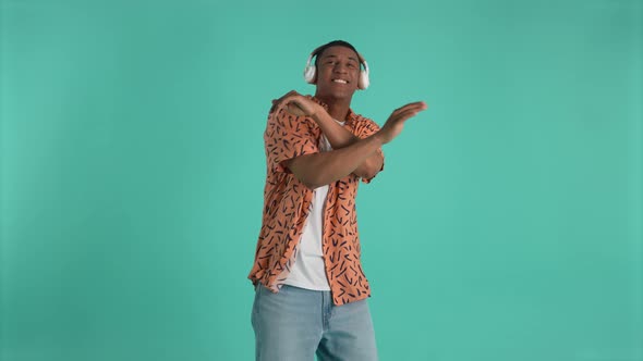 Cheerful African American Guy Dancing to Music