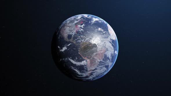 Animation of the planet earth spinning around and changing colors in a blue dark background