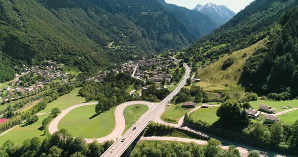 Aerial View of Cars Driving a Mountain Road Valley in Alps, Switzerland 