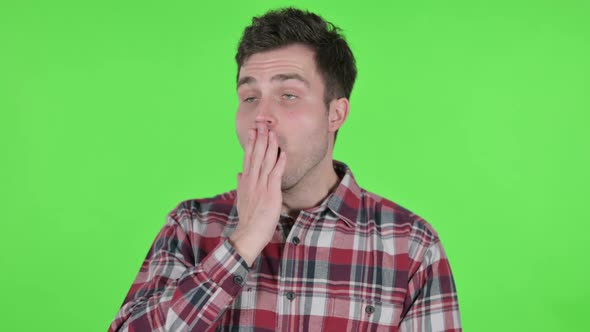 Portrait of Young Man Yawning Green Chroma Screen