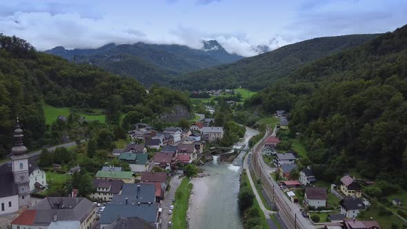 Flying Over Wonderful Small Town Between Mountains in Austria