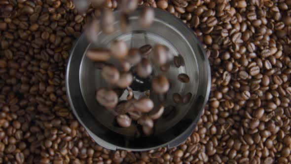 Coffee Grains Pouring Electric Grinder Close Up