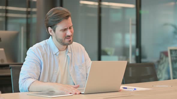 Man with Laptop Having Loss Failure