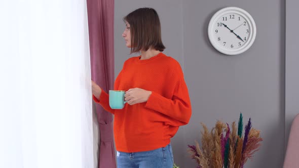 Woman looking out the window