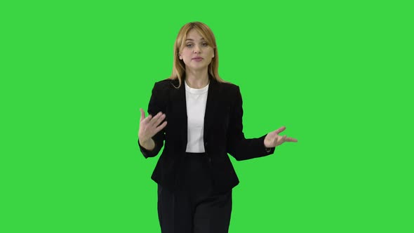 Beautiful Young Woman in Formal Outfit Walking and Talking To Camera on a Green Screen, Chroma Key