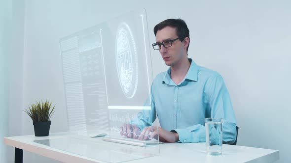 Businessman Looks at Transparent Display with NFT Symbol