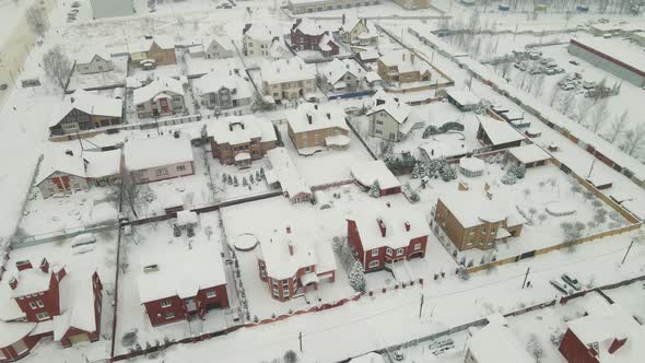 Onestory Residential Buildings in a Snowcovered Suburb After a Blizzard