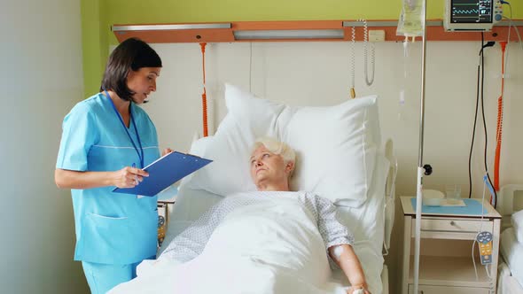 Female nurse interacting with patient