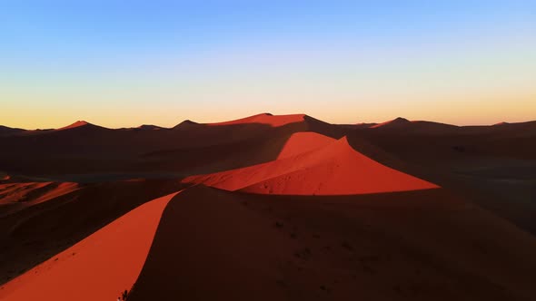 Drone Shot From Height Over Massive Orange Dune in African Desert