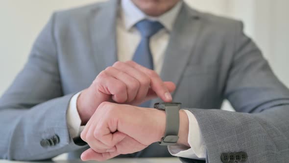 Close Up of Businessman Using Smart Watch Internet