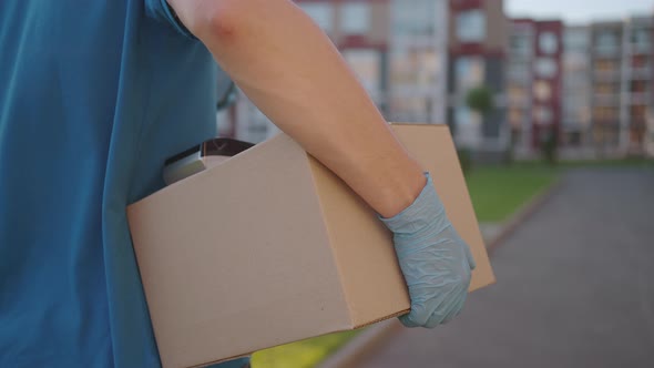 Postman or Delivery Man Carry Small Box Deliver to Customer at Home Contactless Nfc Terminal Payment