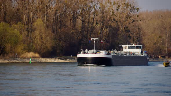 Industrial transport ship sailing with gas or liquids on the Rhine near Karlsruhe, Germany. Yellow s