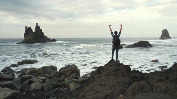 Young Man Tourist Walking on the Famous Volcanic Black Sand Beach Benijo in the North of Canary