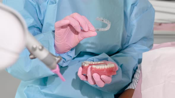 Close Up of Orthodontist Holding Invisible Retainer for Teeth Alignment