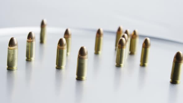 Cinematic rotating shot of bullets on a metallic surface - BULLETS 058