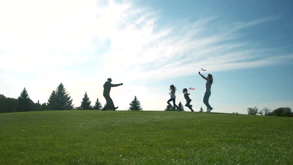 Happy Glad Family Running To Their Arrived Father From Military Misson