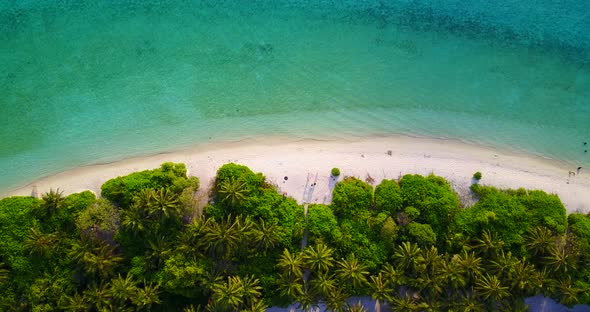 Luxury birds eye travel shot of a summer white paradise sand beach and blue ocean background in high res