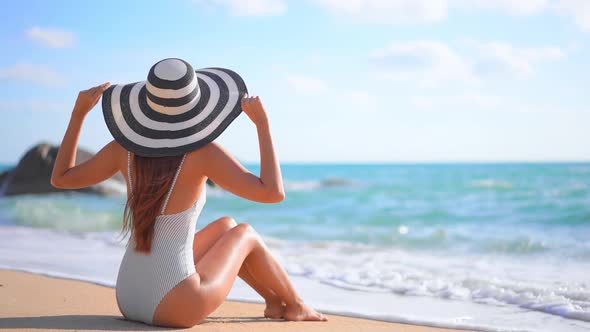 Asian woman enjoy around beautiful beach sea ocean