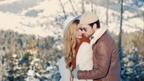 Stylish Couple Walking on Top of the Mountain