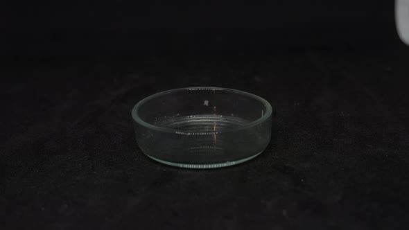 Ashtray with cocaine toxic drug powder being poured in for consumption, closeup