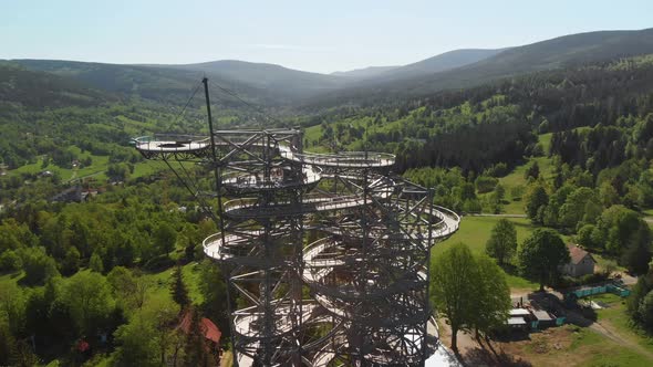 Aerial orbit over the sky walk observation tower in Sudety mountains