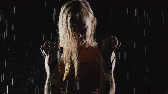 Athletic Blond Woman Working Out In The Rain