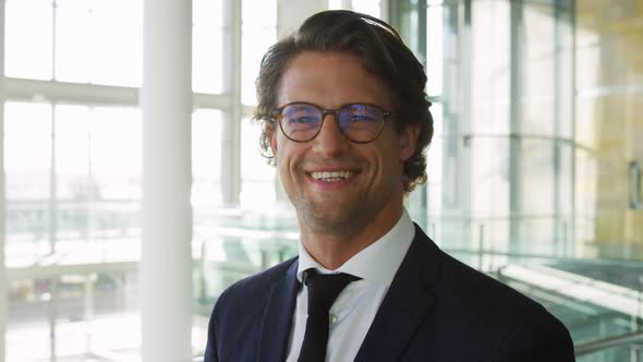 Portrait of young businessman in modern office building