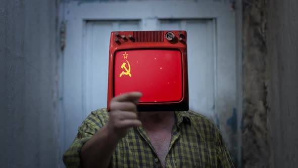 Elderly Man with an Old TV Instead of Head, showing the Flag of the Soviet Union on Screen.
