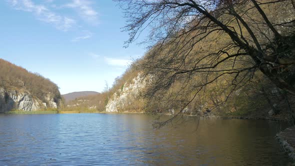 Pan left of a lake in Plitvice Park