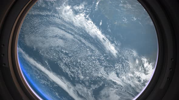 Earth As Seen Through Window Of Spaceship, Flight Of The Space Station Above The alt