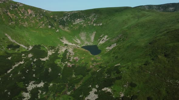 Arial View of the highest lake of Carpathian Mountains - Brebenescul