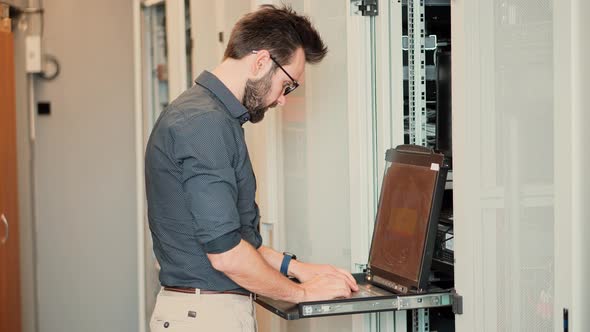 It Administrator In Mining Server Room And Connecting Ethernet Wire. Internet Network Switch.