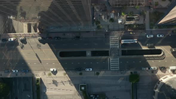 AERIAL: Slow Lowering Birds Eye View Flight Over Downtown Los Angeles California Grand Avenue in