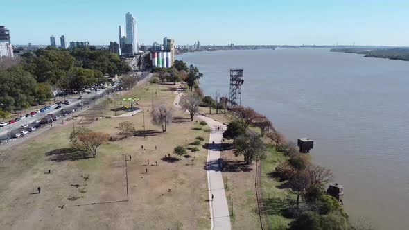 Coast of Rosario Argentina Aerial view people walking and enjoy the city park near the Parana river